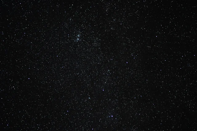A dark winter sky full of stars